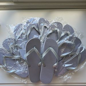 Unopened Grey flip flops size medium $8 FOR SET OF 6